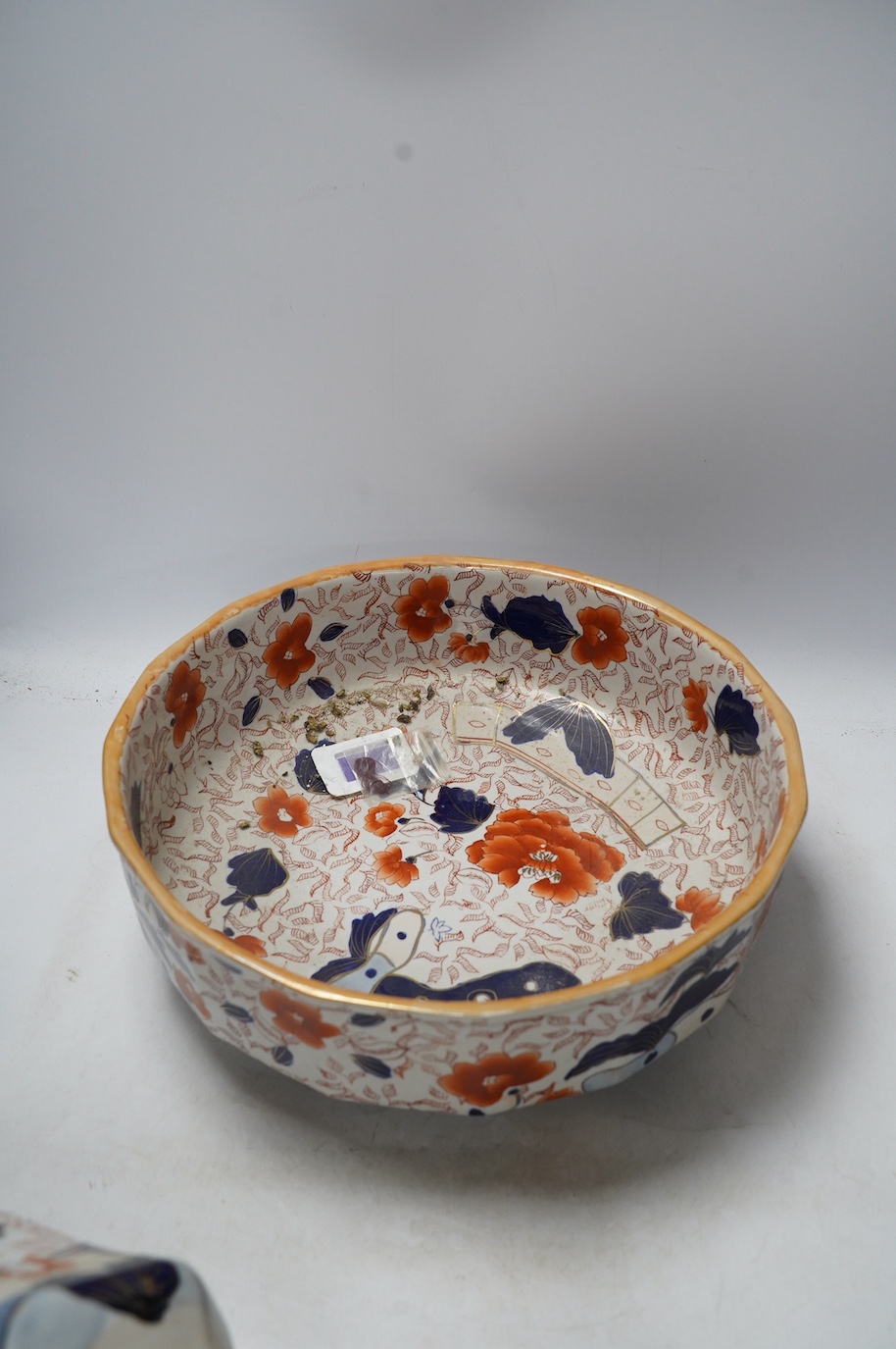 A Masons ironstone Hydra jug and bowl, together with two Royal Crown Derby dinner plates, jug 28cm high. Condition - poor